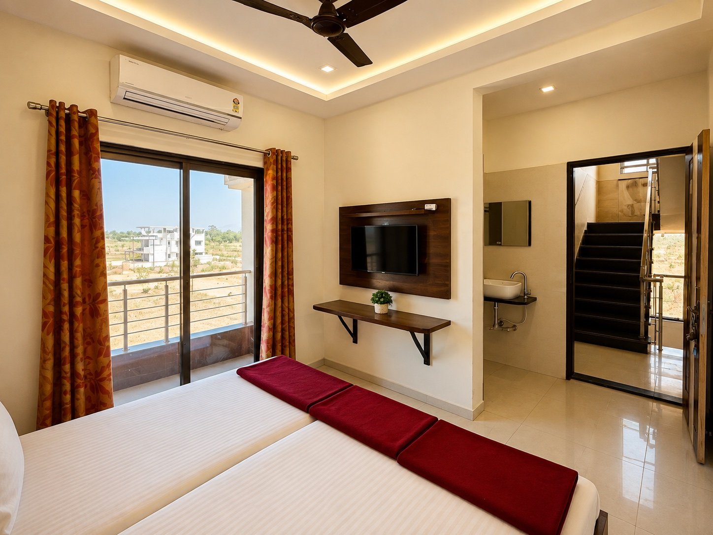 Room with bed, TV and attached bathroom